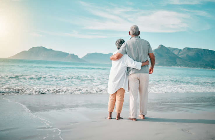 Couple enjoying retirement carefree on a white sandy beach
